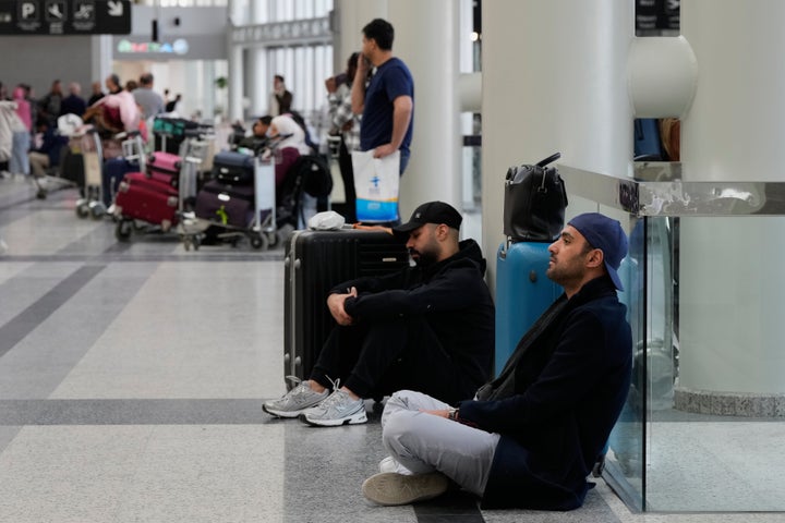 Passengers whose flights were cancelled, wait at the departure terminal of Rafik Hariri International Airport in Beirut, Lebanon, on Feb. 28, 2026, as many airlines canceled flights due to the conflict involving the United States, Israel and Iran.