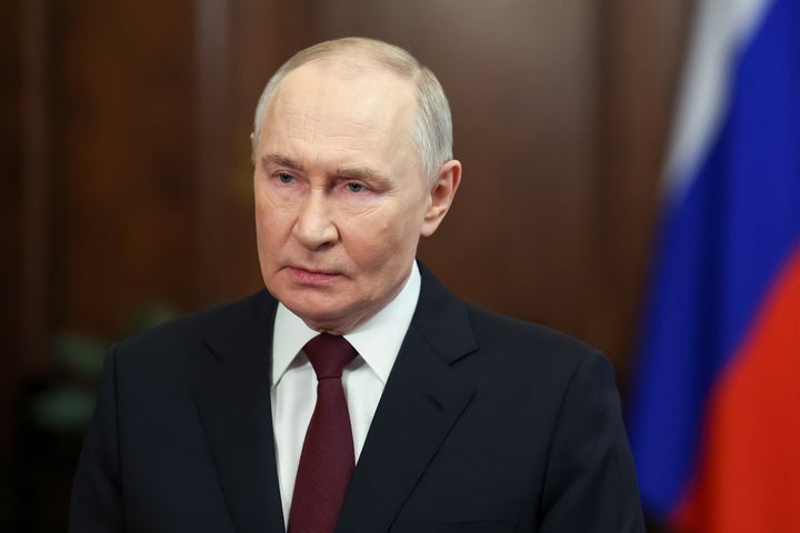 Russian President Vladimir Putin congratulates the personnel and veterans of the military's Special Operations Force on their professional holiday in a video address at the Kremlin in Moscow, Friday, Feb. 27, 2026. (Sputnik, Kremlin Pool Photo via AP)
