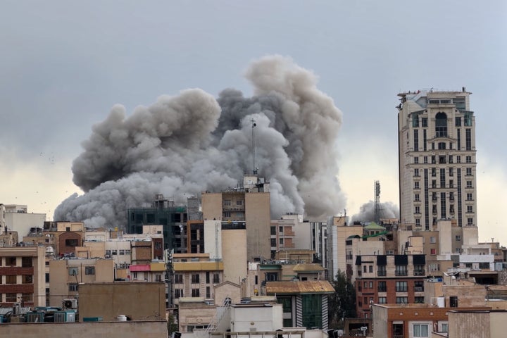 A plume of smoke rises after a strike in Tehran, Iran, on March 2, 2026. 