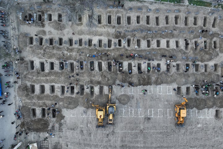 In this aerial handout picture released by the Iranian Press Center, mourners dig graves during a funeral for children killed in a reported strike on a primary school in Iran on March 3, 2026. Iranian media have reported hundreds of Iranian casualties, including at a girl's school, although AFP reporters have not been able to verify tolls independently. 