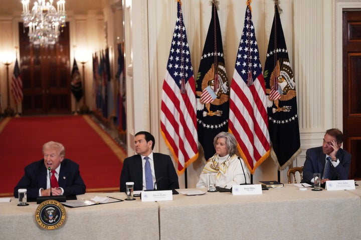 President Donald Trump, Secretary of State Marco Rubio, White House chief of staff Susie Wiles and former Alabama head coach Nick Saban attend a roundtable discussion on college sports in the East Room of the White House, Friday, March 6, 2026, in Washington. (AP Photo/Julia Demaree Nikhinson)