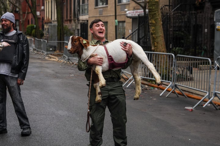 Right-wing influencer Jake Lang carries a goat during a protest organized by the influencer on March 7, 2026 in New York City. 