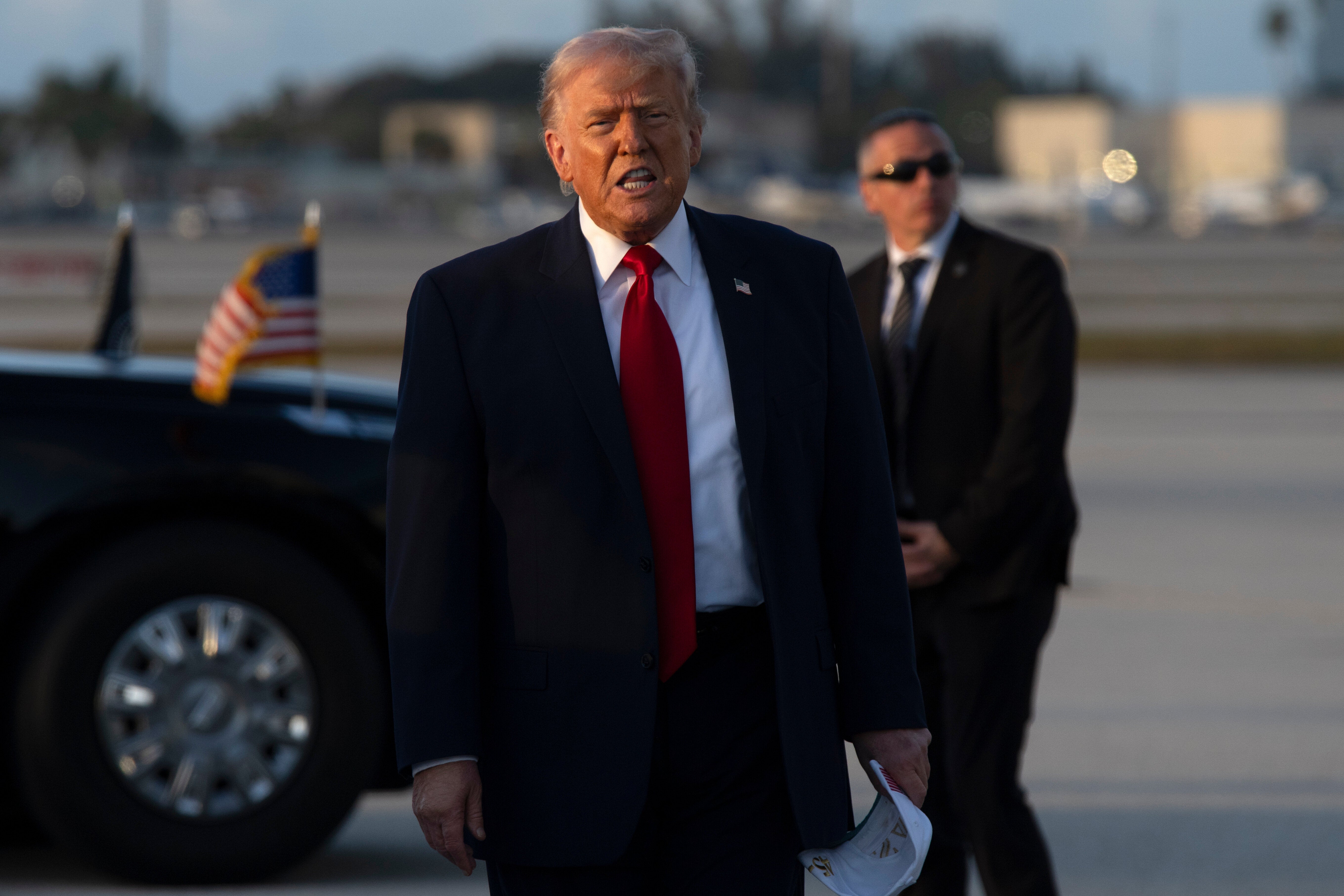 President Donald Trump gestures after stepping off Air Force One, Saturday, March 7, 2026, at Miami International Airport in Miami. (AP Photo/Mark Schiefelbein)