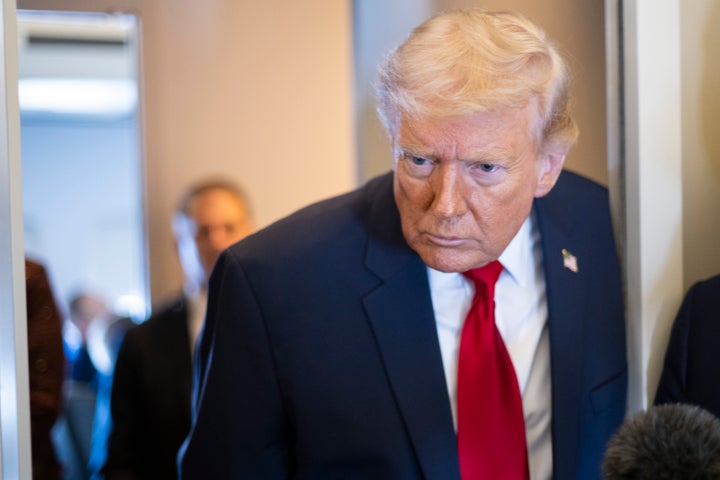 IN FLIGHT- MARCH 7:U.S. President Donald Trump listens to a question as he speaks to members of the media traveling on Air Force One while heading to Miami on March 7, 2026. President Trump and other members of the government attended the dignified transfer of six soldiers from the 103rd Sustainment Command who were killed in action by an Iranian drone strike on March 1 in Port of Shuaiba, Kuwait during "Operation Epic Fury". (Photo by Roberto Schmidt/Getty Images)