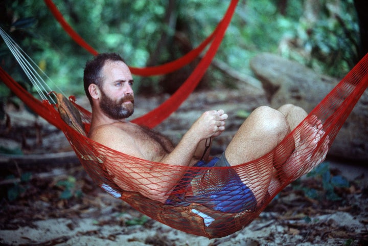 Richard Hatch, seen here, lounges in a hammock during the first season of "Survivor." Hatch ultimately won the competition and was awarded $1 million. In 2006, he was sentenced to 51 months in prison after he failed, in part, to report his winnings from the show. He later appeared on "The Celebrity Apprentice."