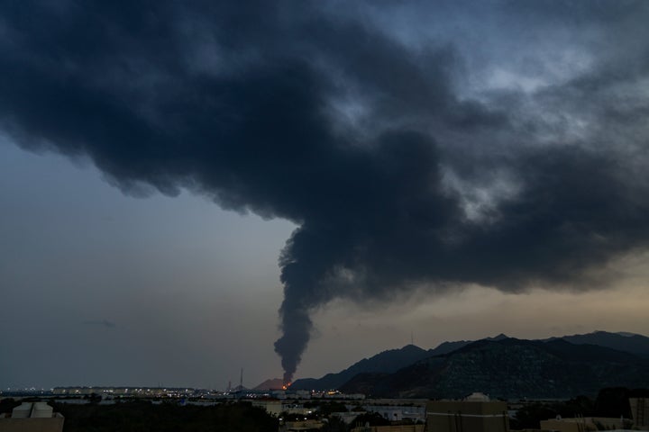 Fire and a plume of smoke is visible after, according to authorities, debris of an Iranian intercepted drone hit the Fujairah oil facility, in Fujairah, United Arab Emirates, March 3, 2026. 