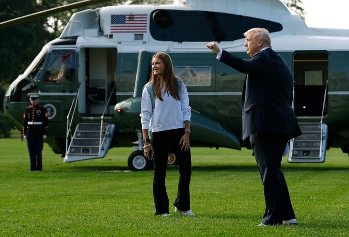 President Donald Trump and his granddaughter Kai Trump walk to Marine One on the South Lawn of the White House in 2025.