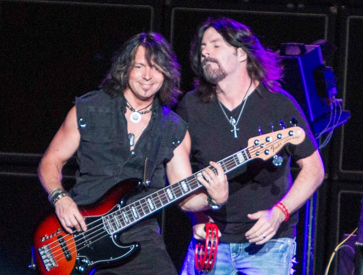 Boston bassist Tracy Ferrie and singer Tommy DeCarlo performing at the Verizon Wireless Amphitheater in Atlanta on June 14, 2014.