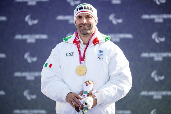 Emanuel Perathoner of Team Italy celebrates at the medal ceremony for the Men's Para Snowboard Cross SB-LL2 Final.