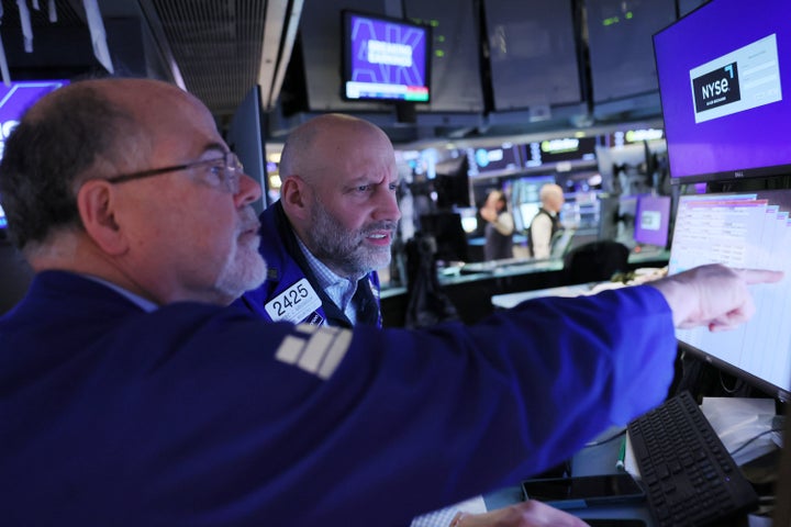 Traders work on the floor of the New York Stock Exchange during morning trading on March 10, 2026 in New York City. Stocks continued to slide at the opening due to the war in Iran and oil prices hovering around $90 per barrel.