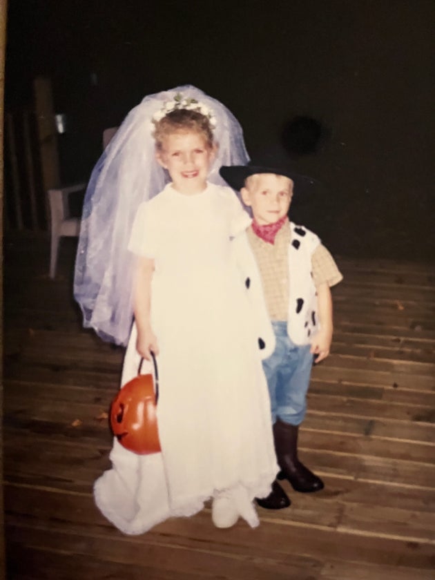 The author at 5 years old dressed as a bride, pictured with her younger brother