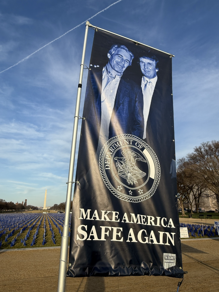 Ten-foot high banners erected by the group known as The Secret Handshake have gone up around the U.S. Capitol.
