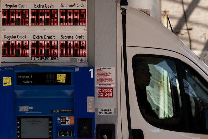 A person sits in a car as a sign showing the gas price at a gas station, Tuesday, March 10, 2026, in New York. (AP Photo/Yuki Iwamura)