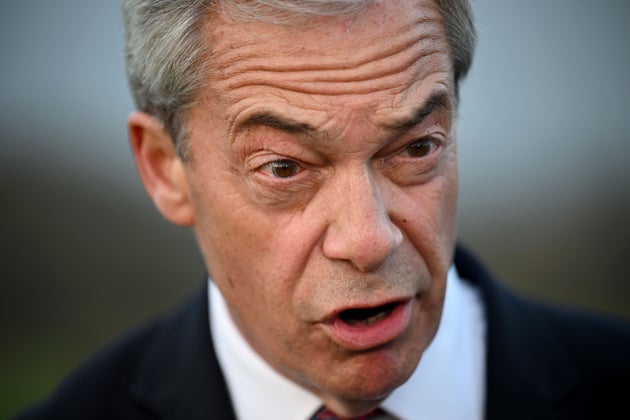 Reform UK leader Nigel Farage talks to the media before attending a rally as part of Reform UK's local election campaign on March 9, 2026 in Newport, Isle of Wight. 