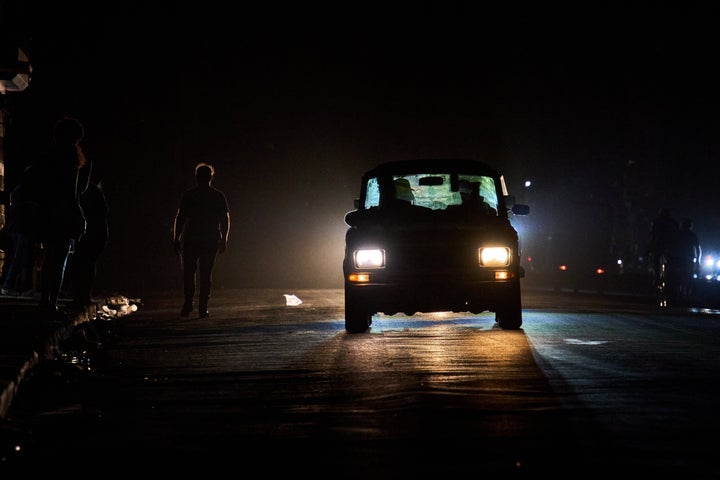 A vehicle drives down a street during a blackout in Havana, Wednesday, March 4, 2026. (AP Photo/Ramon Espinosa)