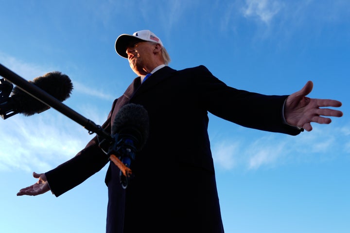 President Donald Trump speaks to reporters before he boards Air Force One, Friday, March 13, 2026, at Joint Base Andrews, Md., for a trip to Florida. (AP Photo/Mark Schiefelbein)