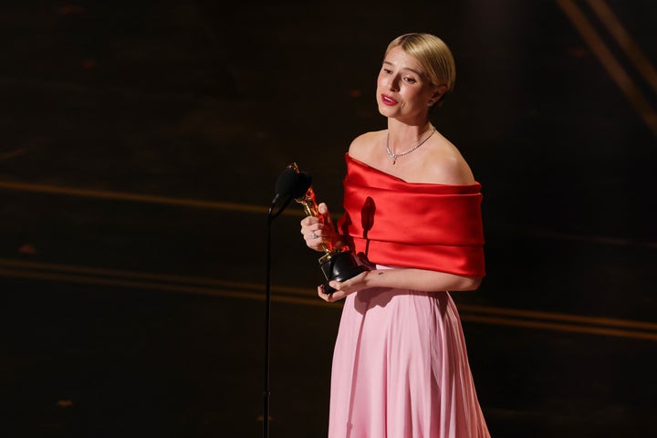 Jessie Buckley accepts the award for lead actress for 