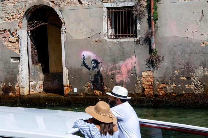 A view of street artiste Banksy's work of a migrant child appears on the outer wall of a house overlooking the Rio Ca Fossari, made by the artist during the 58th International Art Biennale on May 15, 2019 in Venice, Italy. In Venice, Italy, on 6 September 2022. (Photo by Riccardo Fabi/NurPhoto via Getty Images)