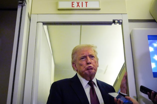President Donald Trump speaks to reporters aboard Air Force One, Sunday, March 15, 2026, en route from West Palm Beach, Fla. to Joint Base Andrews, Md.