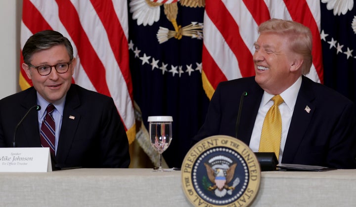 President Donald Trump sits with Speaker of the House Mike Johnson (R-La.) during a meeting with the board members of the Kennedy Center on Monday.