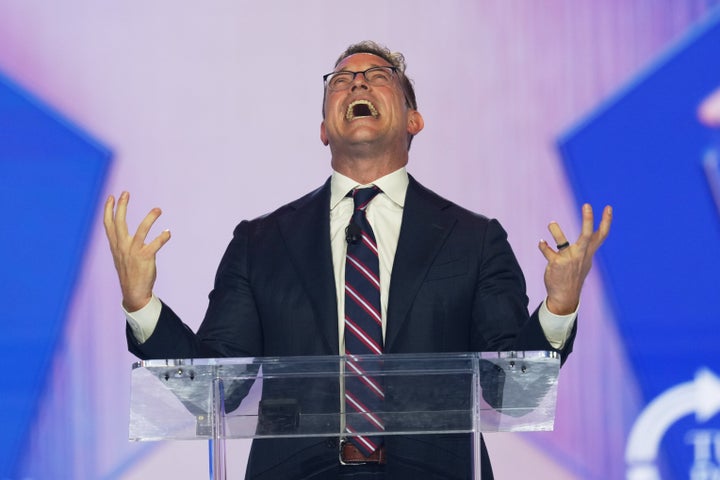 Johnson, cartoonishly gesticulating while speaking at Turning Point USA's AmericaFest 2025.