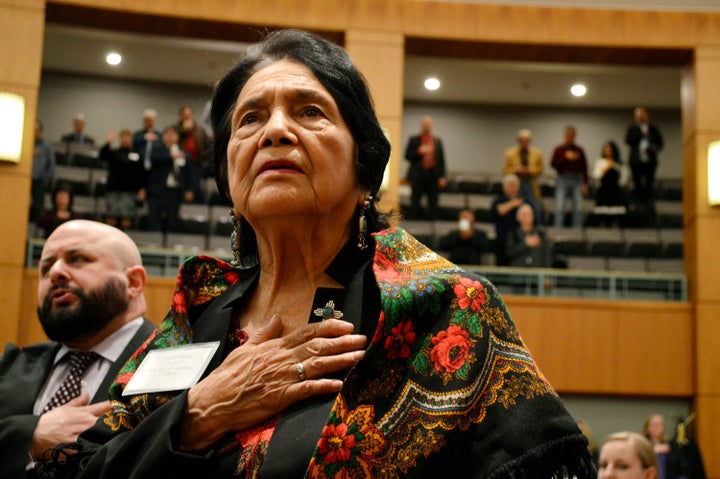 Dolores Huerta, the Mexican American social activist who formed a farmworkers union with Cesar Chavez, stands for the Pledge of Allegiance in Spanish in 2019 while visiting the New Mexico Statehouse in Santa Fe.