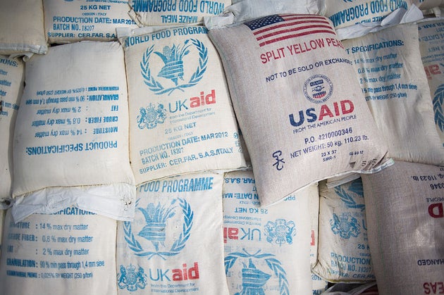 Sacks of food aid from the World Food Programme donated by the United Kingdom and the United States sit in the back of a truck at the Mugunga III camp for internally displaced persons (IDPs) in the east of the Democratic Republic of the Congo on December 2, 2012. UN refugee agency officials reported cases of looting and rape in an attack late yesterday on the giant Mugunga camp, which lies about 10 kilometres (six miles) west of Goma and is home to up to 35,000 displaced people. AFP PHOTO/PHIL MOORE (Photo by PHIL MOORE / AFP via Getty Images)