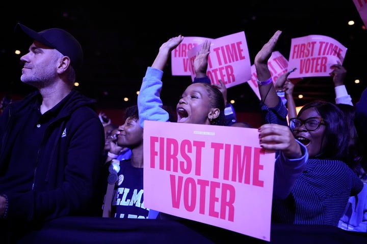 A first-time voter applauds before former first lady Michelle Obama speaks in College Park, Georgia, on October 29, 2024. 