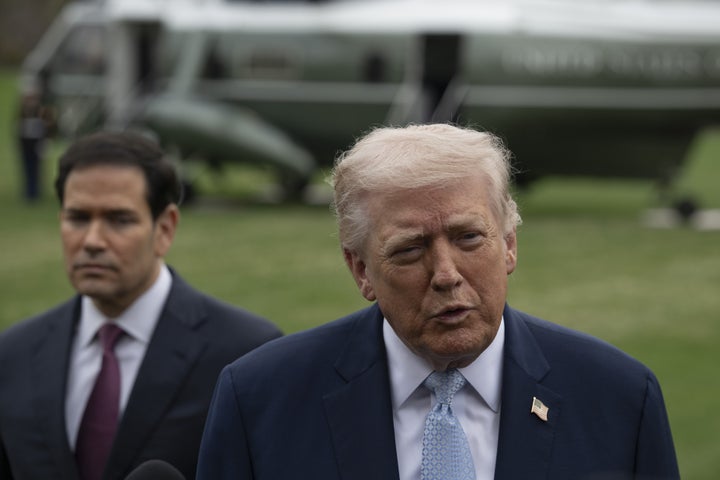 WASHINGTON DC, UNITED STATES - MARCH 20: United States President Donald Trump (R) speaks to the press before his departs the White House en route Miami, Florida on March 20, 2026, in Washington DC. Also The United States Secretary of State Marco Rubio (L) is seen. (Photo by Celal Gunes/Anadolu via Getty Images)