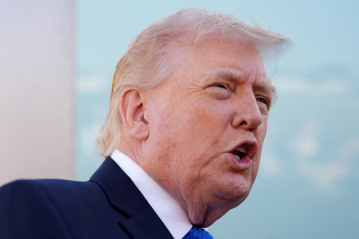 President Donald Trump speaks with the media before boarding Air Force One, Monday, March 23, 2026, at Palm Beach International Airport in West Palm Beach, Fla.