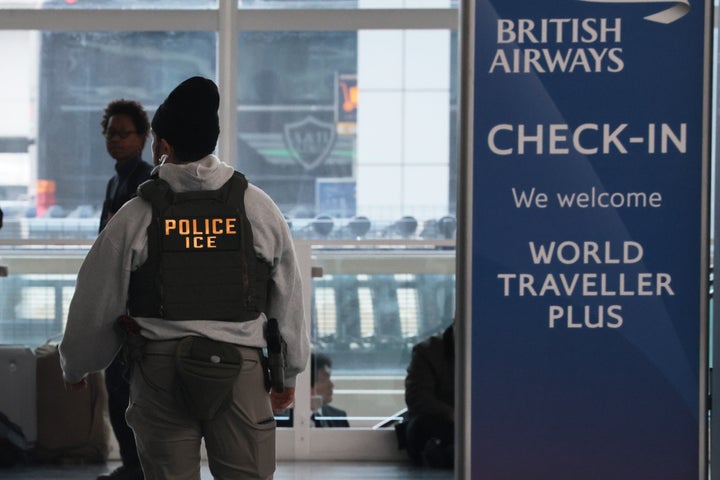 U.S. Immigration and Customs Enforcement (ICE) officers patrol John F. Kennedy International Airport on Monday in New York City. The travel disruptions continue as hundreds of TSA officers quit or work without pay during a partial government shutdown. President Donald Trump said ICE officers will be deployed to U.S. airports on Monday, with border czar Tom Homan in charge of the effort.