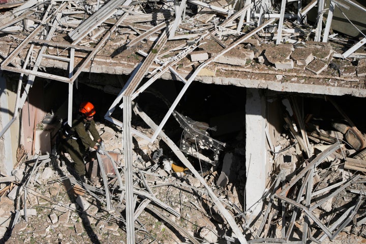 An Israeli rescue officer responds at the scene of an Iranian missile attack in Tel Aviv, Israel, on March 24, 2026.