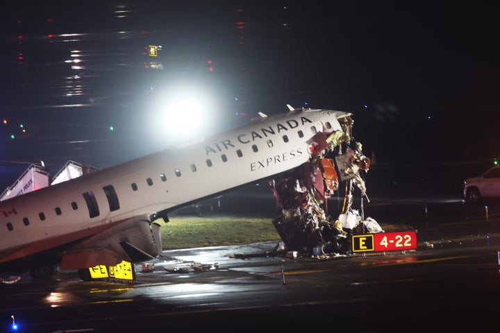 An Air Canada plane sits on the tarmac after it collided with a fire truck at LaGuardia Airport on March 23, 2026 in New York City.