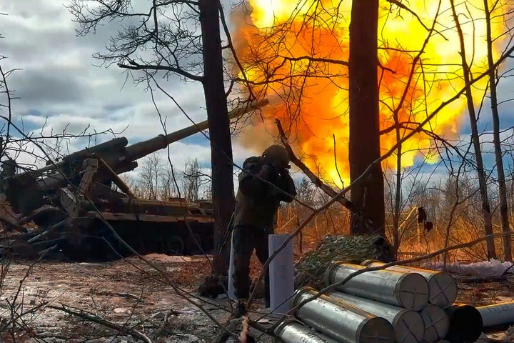 In this image made from video provided by the Russian Defense Ministry Press Service on March 23, 2026, a Russian Pion self-propelled 203 mm cannon fires towards a Ukrainian position.