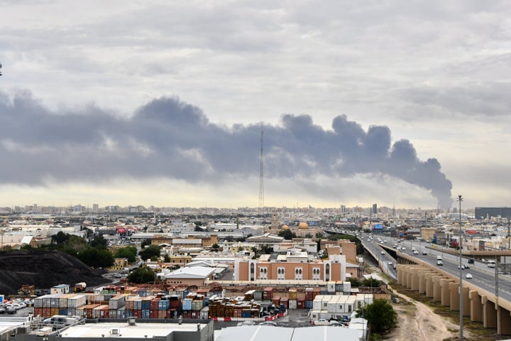 Smoke rises from Kuwait International Airport after a drone attack on a fuel depot in Kuwait City, Kuwait, Friday, March 25, 2026.