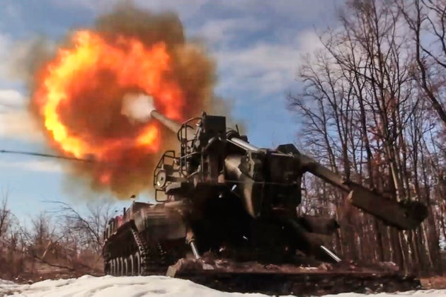 In this image made from video provided by Russian Defense Ministry Press Service on Monday, March 23, 2026, a Russian Pion self-propelled 203 mm cannon fires towards a Ukrainian position. 