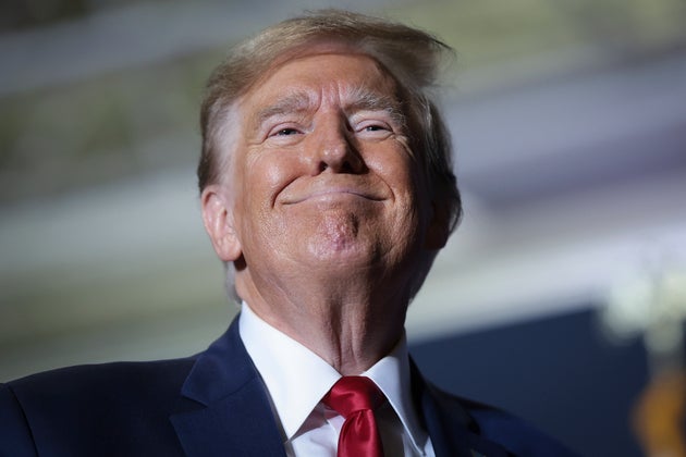 President Donald Trump smiles at supporters after speaking at a rally at the North Charleston Convention Center on February 14, 2024, in North Charleston, South Carolina.