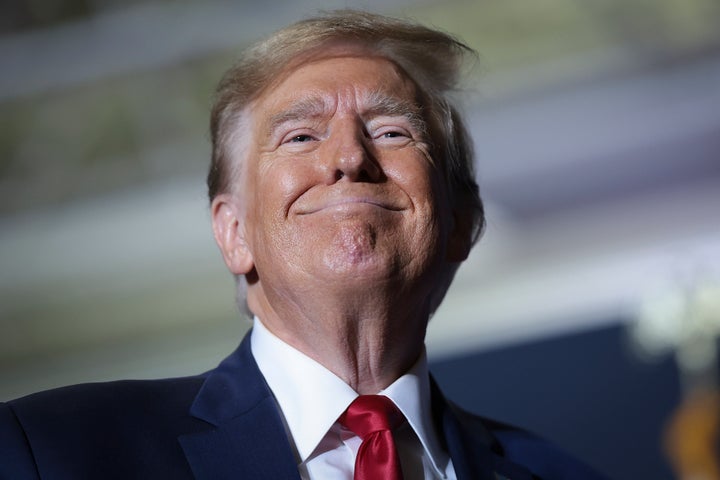 President Donald Trump smiles at supporters after speaking at a rally at the North Charleston Convention Center on February 14, 2024, in North Charleston, South Carolina.