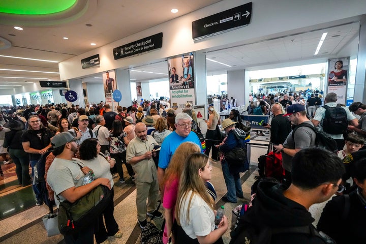 Airline passengers wait in long lines to go through TSA security screening at William P. Hobby Airport in Houston on March 8, 2026.