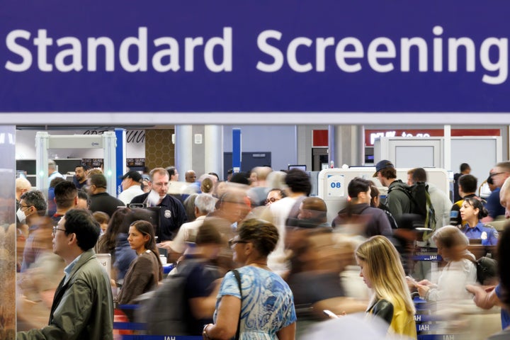 Travelers wait in line at a Transportation Security Administration (TSA) checkpoint at George Bush Intercontinental Airport (IAH) in Houston, Texas, US, on Thursday, March 26, 2026. (Photographer: Mark Felix/Bloomberg via Getty Images)