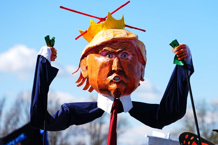 Demonstrators hold an effigy of US President Donald Trump during the "No Kings" national day of protest near the Memorial Bridge in Washington, D.C.