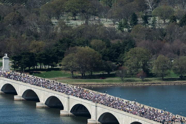 Demonstrators march across Memorial Bridge during the No Kings protest in Washington, Saturday, March 28, 2026. 