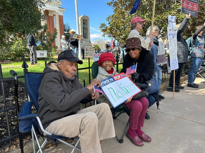 Melissa Graves, right, and her parents attend a "No Kings" protest in Louisa County, Virginia.