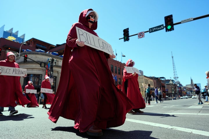 Demonstrators dressed as characters from the TV series, "The Handmaid's Tale," march during a "No Kings" protest in Nashville, Texas.