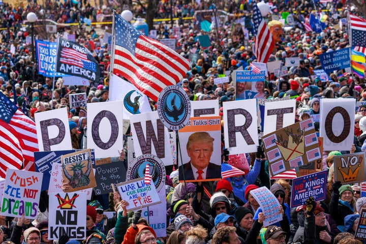 A large crowd gathers and holds protest signs during the "No Kings" national day of protest outside the Minnesota State Capitol building in Saint Paul, Minnesota, on March 28, 2026. 