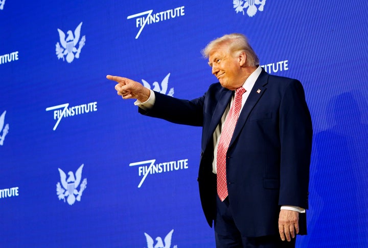 MIAMI BEACH, FLORIDA - MARCH 27: U.S. President Donald Trump gestures to the crowd before speaking at the FII PRIORITY Summit at the Faena Hotel on March 27, 2026 in Miami Beach, Florida. This is the second year President Trump has spoken at the Saudi-backed investment summit. (Photo by Nathan Howard/Getty Images)