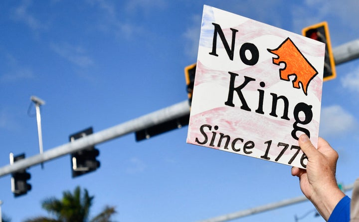 A protest sign seen in Palm Beach, Florida, on March 7.