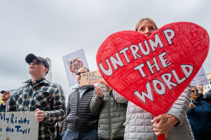 DALLAS, TEXAS - MARCH 28: People rally at the Dallas City Hall Plaza in protest against the Trump administration during a "No Kings" demonstration on March 28, 2026 in Dallas, Texas. This is the third nationwide "No Kings" protest held against the Trump administration. (Photo by Brandon Bell/Getty Images)