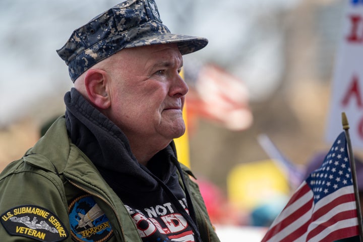 Ken MacDonald tears up as he listens to a speech about the plight of his fellow veterans at the rally in Hartford, Connecticut. "[Trump]'s playing with the lives of military people," he said.