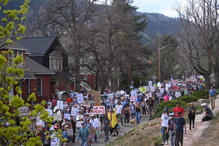 Thousands of protesters march during the the "No Kings" march and visibility event in Boulder, Colorado.